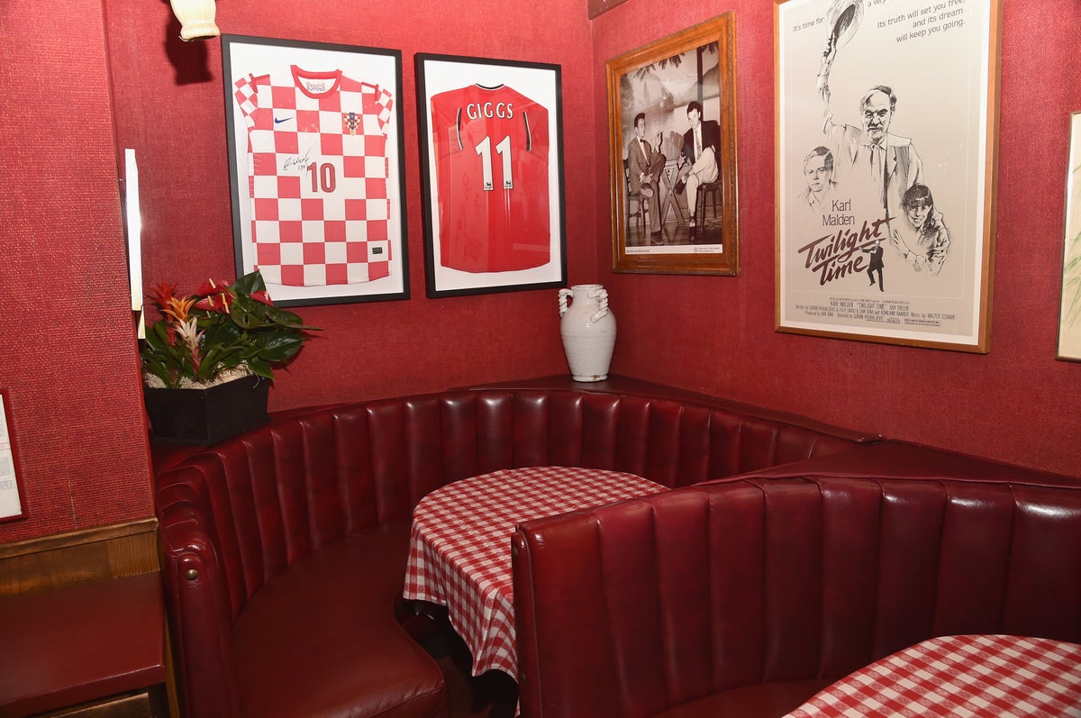 While attracting a famous crowd was never Tana’s intention, the restaurant’s timeless, red-checkered tablecloths and homey atmosphere has drawn generations of high-profile regulars (Getty Images)